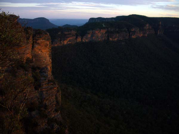 nape piercing meu piercing, a tattoo is on the back of the neck, About 4:30 pm, looking back from Narrow Neck to Katoomba with the sheer